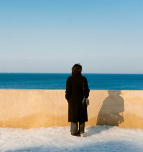 Person gazing at the ocean