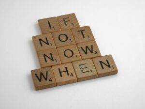 Scrabble tiles forming motivational phrase that you need to begin your work.