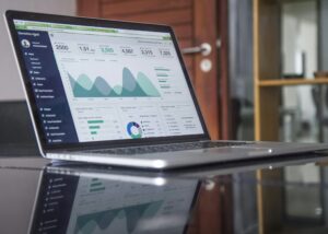 Laptop displaying data analytics dashboard.