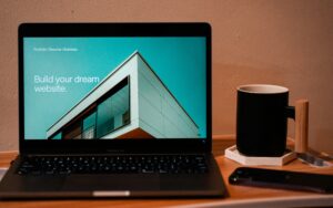 Laptop displaying website design concept, best places for beginners to find freelance clients.