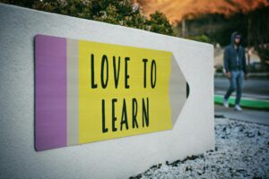 Colorful sign promoting learning and education.